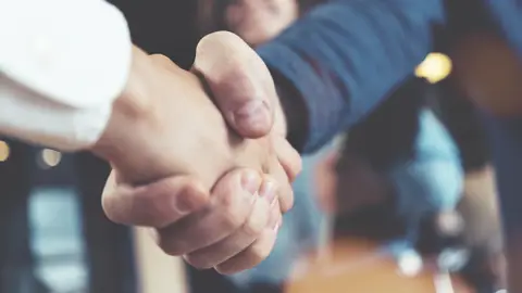 Closeup af et håndtryk